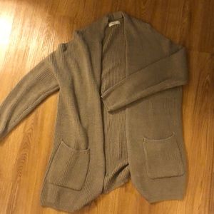 Tan sweater with open shoulder cutout